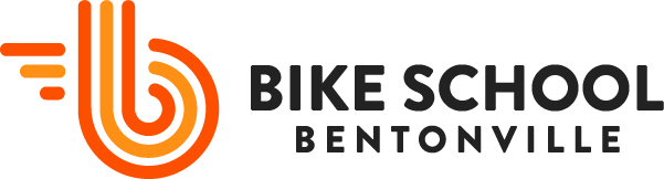 Bike School Bentonville logo with orange and black.