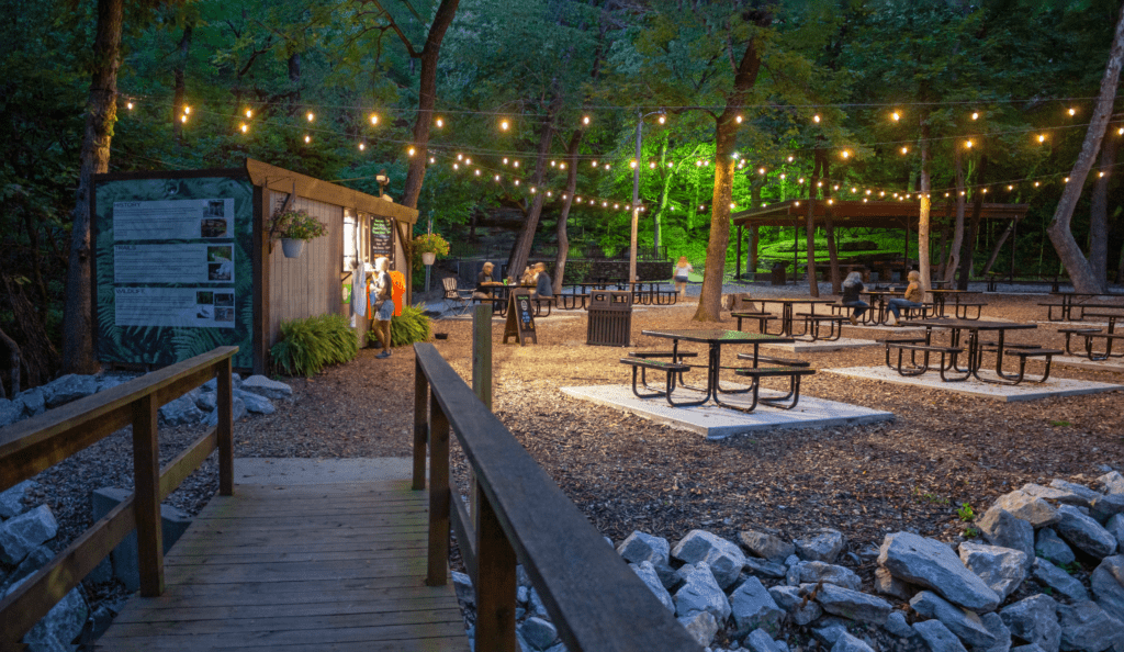 Panoramic photo of the Gear Garden in the evening with string lights.