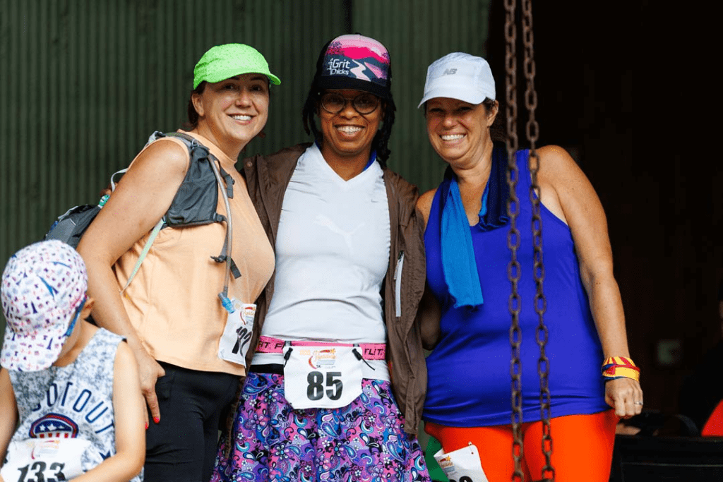 Group of 3 female racers posing for a photo.