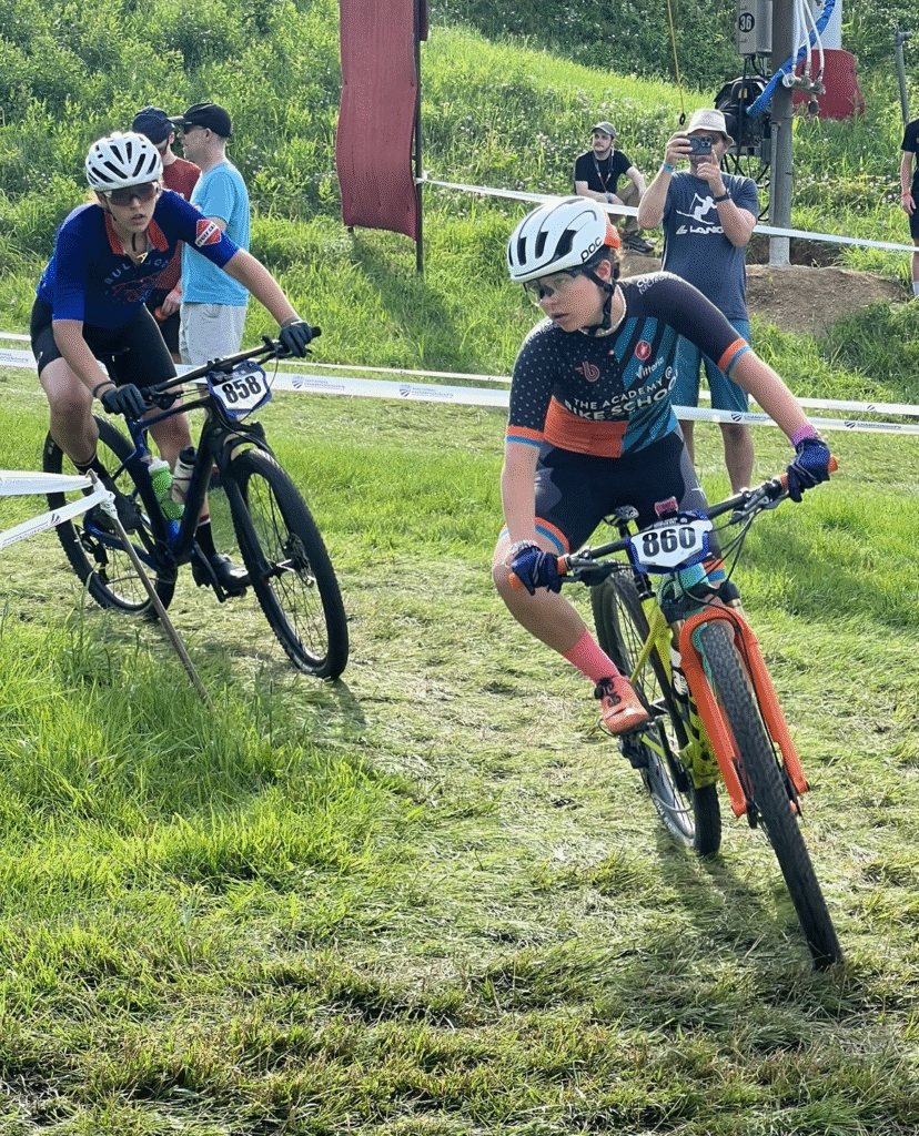 Maddy with Bike School Bentonville racing her mountain bike.